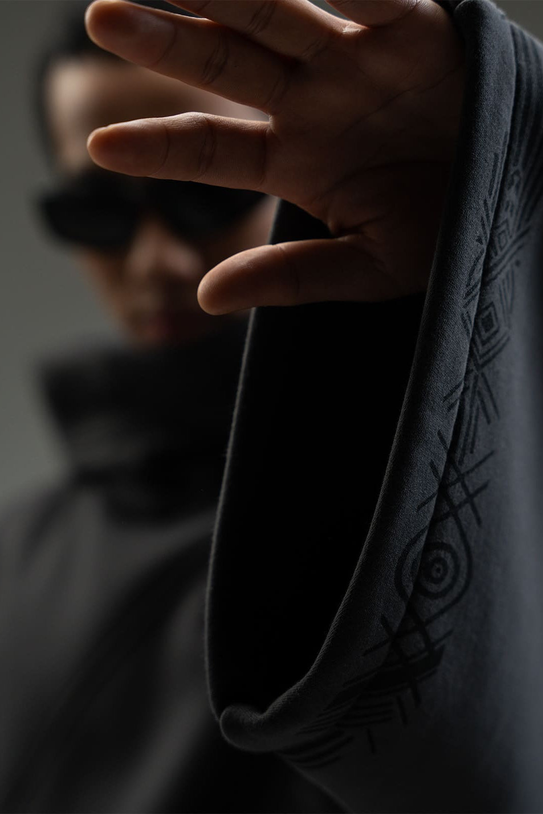 Close-up of heavy cotton fleece fabric on Voidform grey hoodie