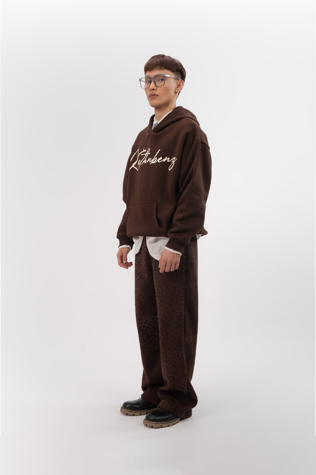 Side angle view of Verbal Kiss oversized winter streetwear hoodie on model