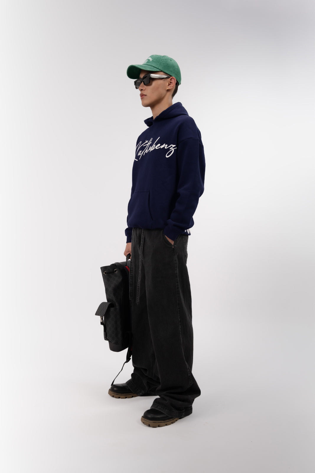 Side angle view of Verbal Sin oversized winter streetwear hoodie on model