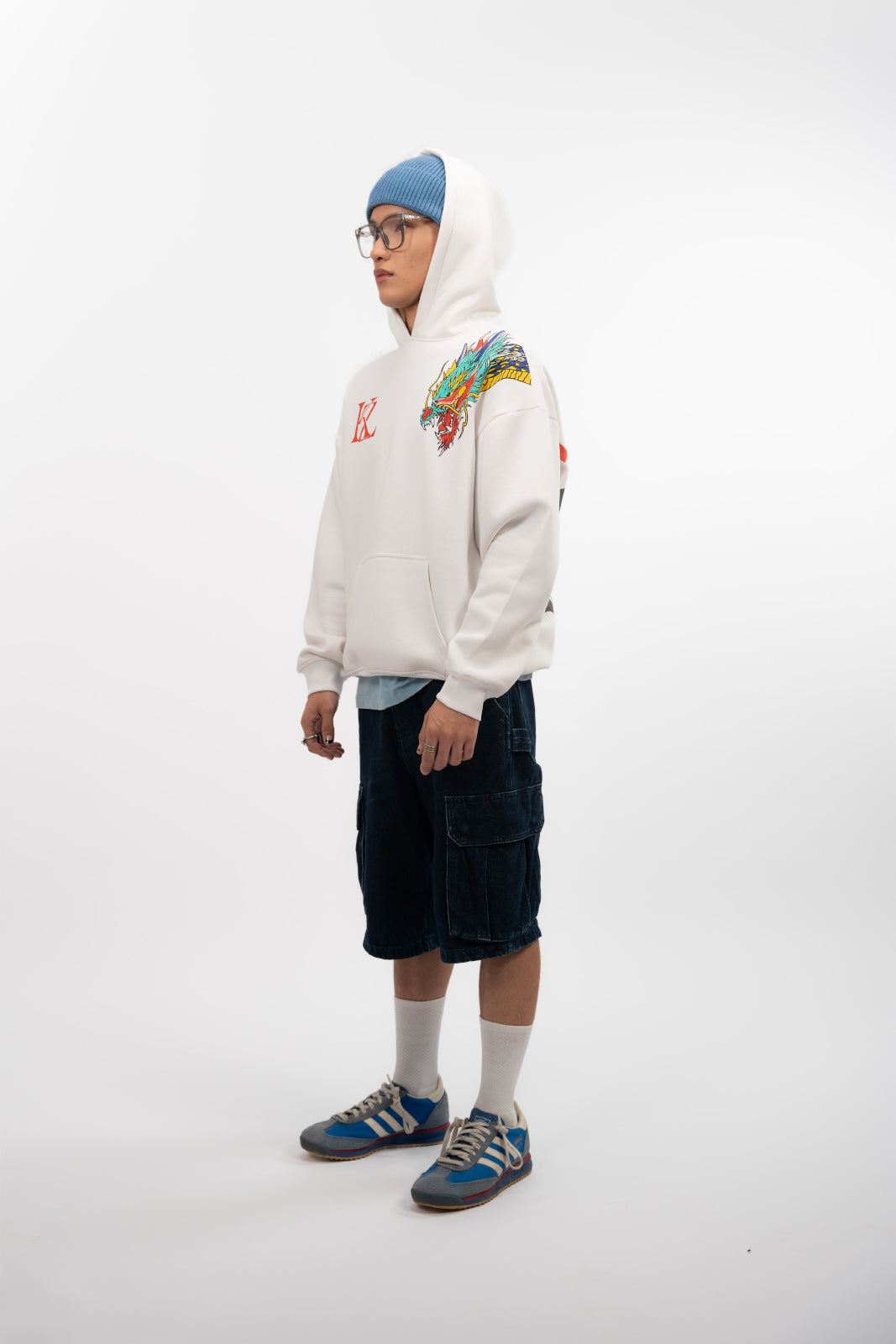 Side profile of Blinding Fang oversized hoodie off white worn by model