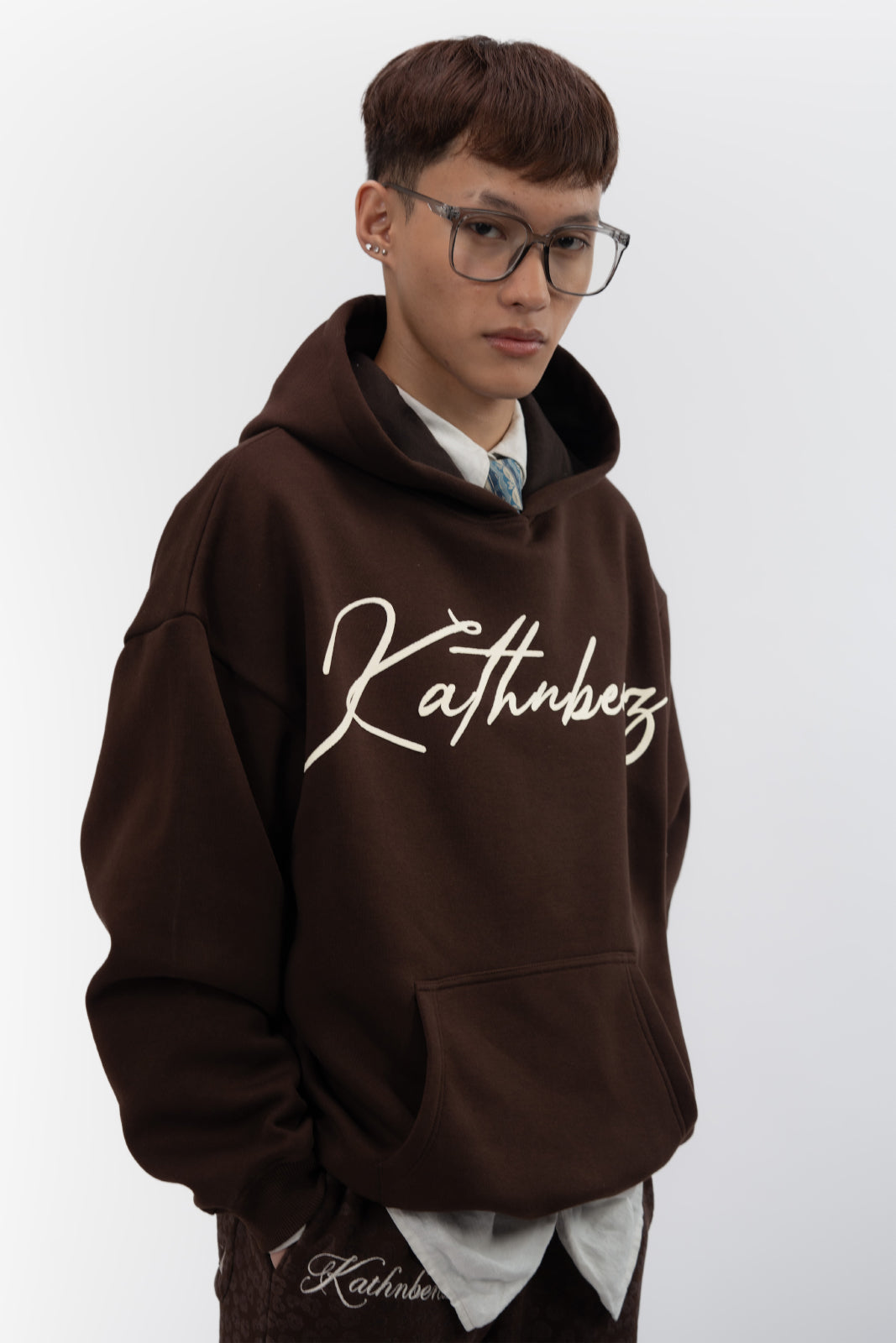 Front chest branding detail on Verbal Kiss oversized cotton fleece hoodie