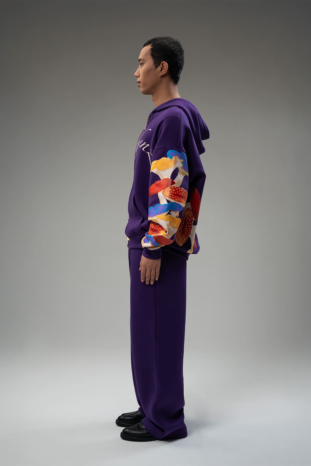 Mushroom artwork detail on Psil purple zipper jacket sleeve