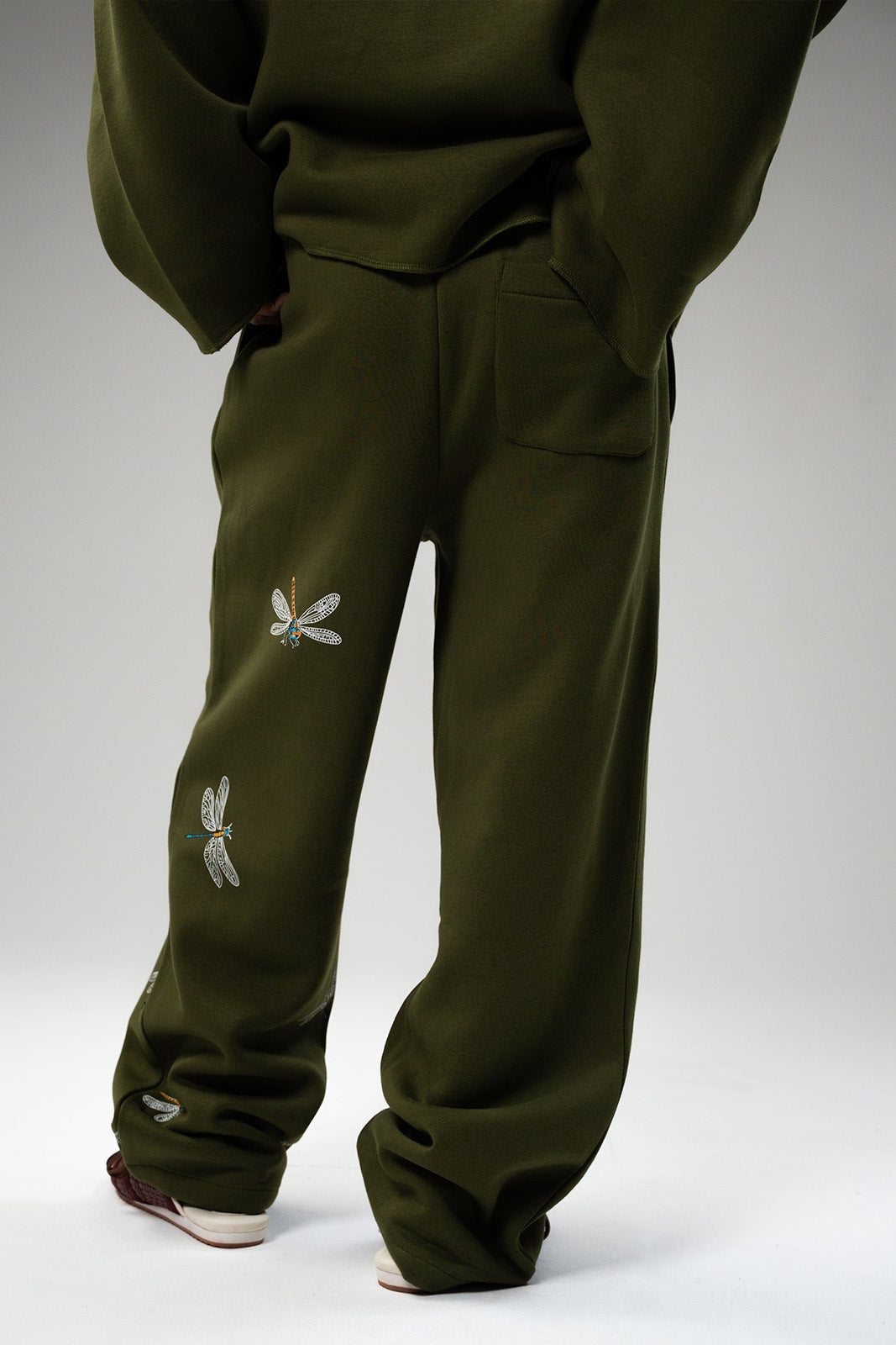 Back view of Low Gravity green fleece pants with easy silhouette