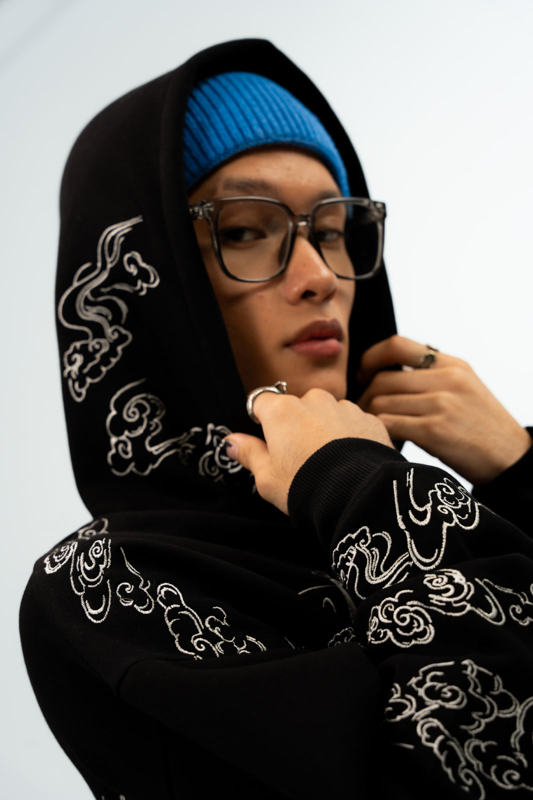 Person wearing a Black Embroidery hoodie