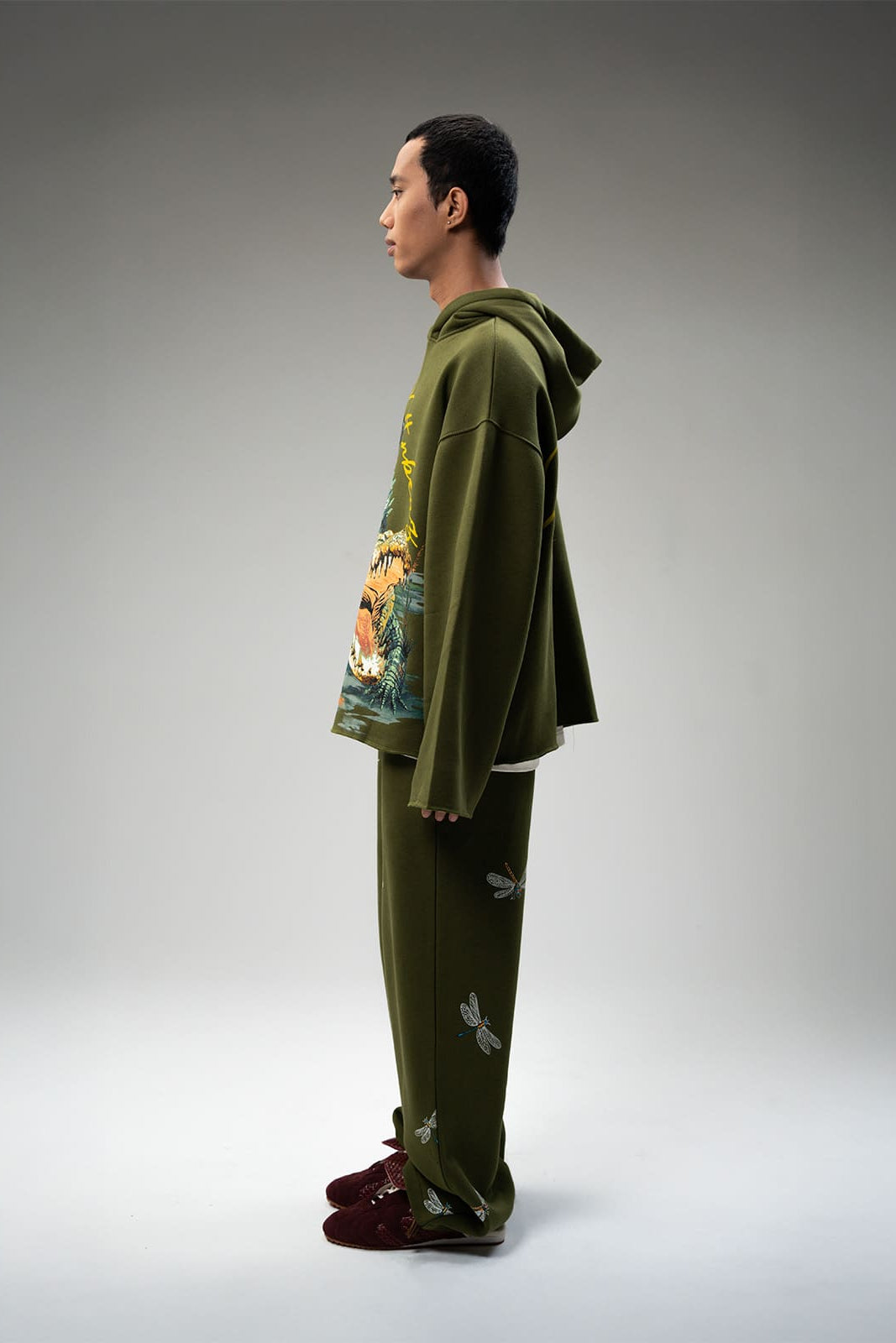 Side profile of Marsh Lord hoodie highlighting oversized silhouette