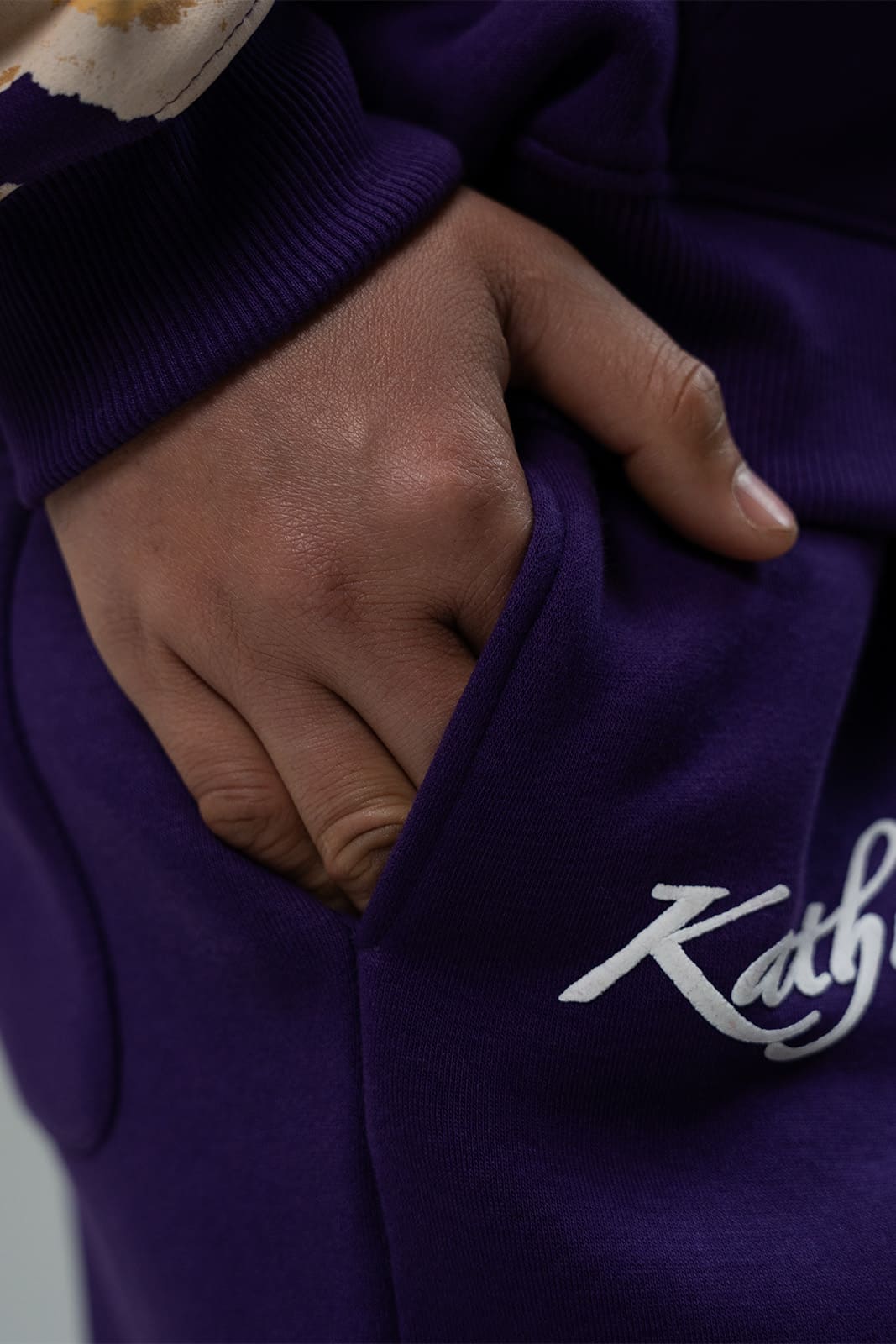 Purple State fleece pants showing minimal logo detailing
