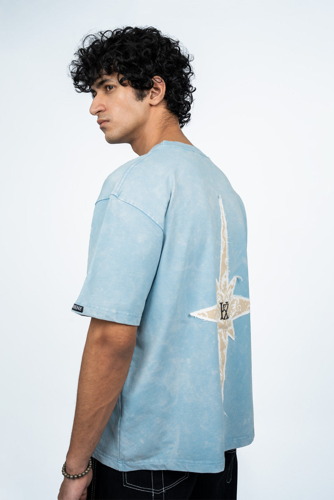 Side view of Azure Vestment oversized T-shirt showing relaxed silhouette and premium Terry Cotton Lycra fabric