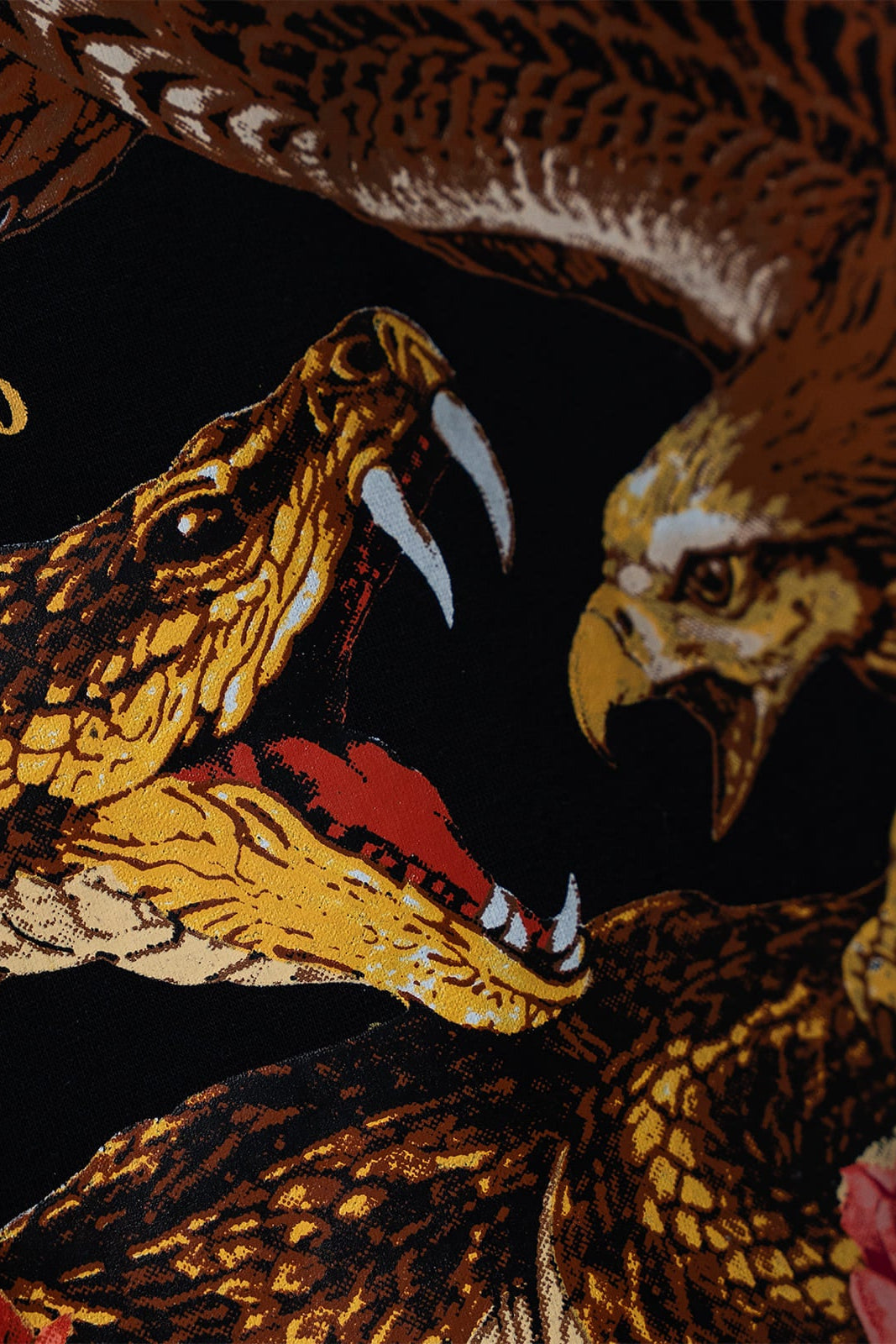 Eagle vs snake artwork detail on Dominion black jacket