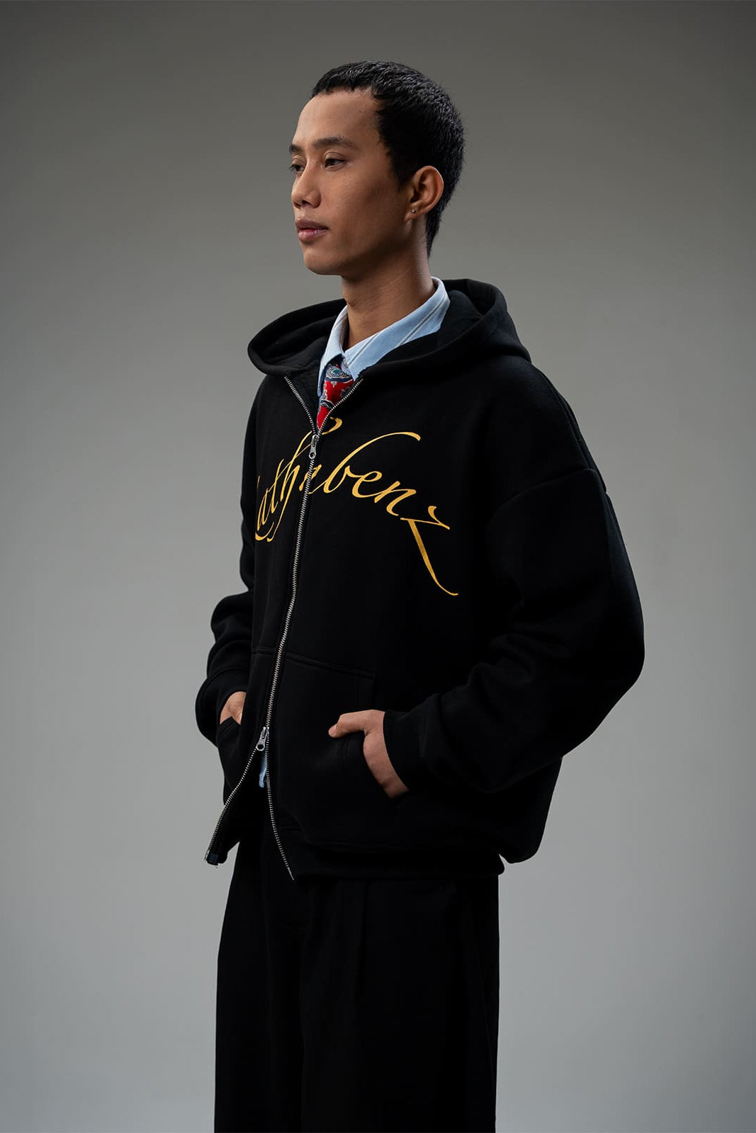 Kathnbenz branding detail on Dominion black fleece jacket