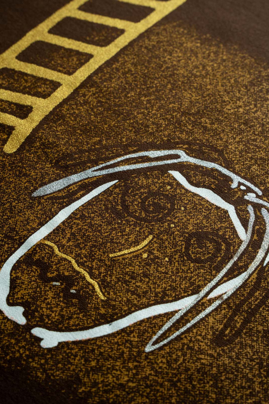 Close-up of Astro Phantom t-shirt front print in terry cotton fabric